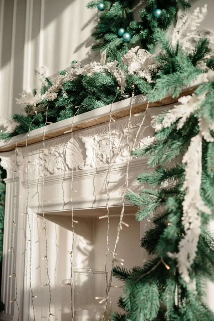 A mantle with garlands, lights and ornaments.