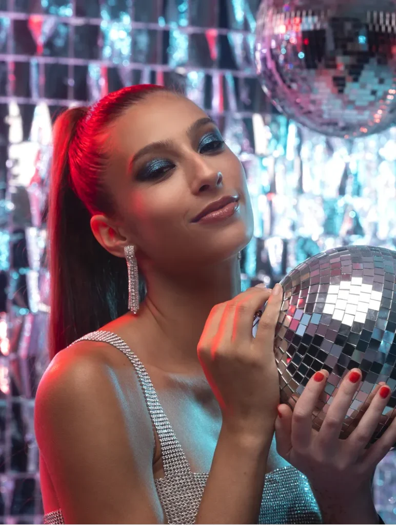 A woman in a disco ball themed wedding picture.