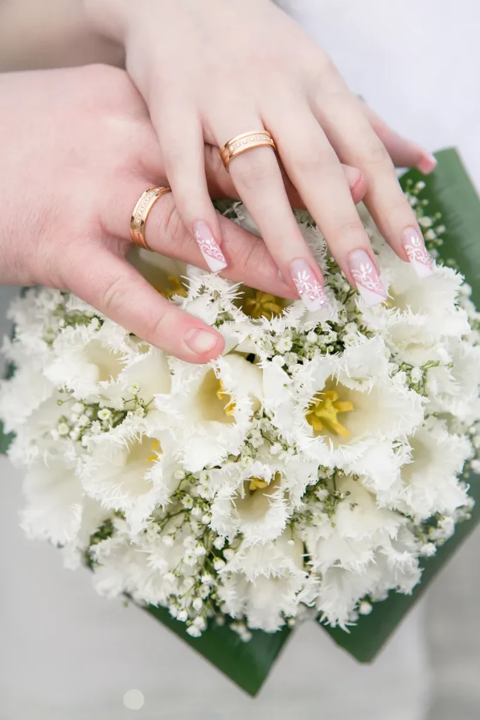 Some gorgeous white floral wedding nails.
