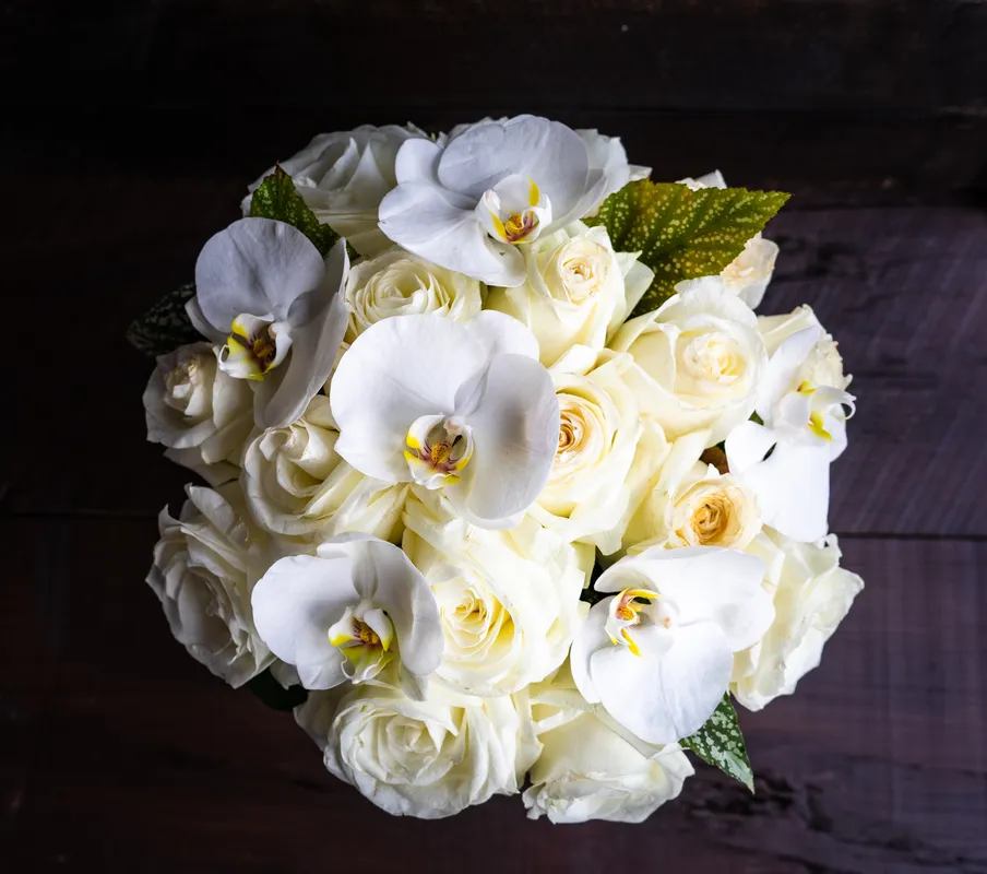 A beautiful bouquet of white roses and orchids.