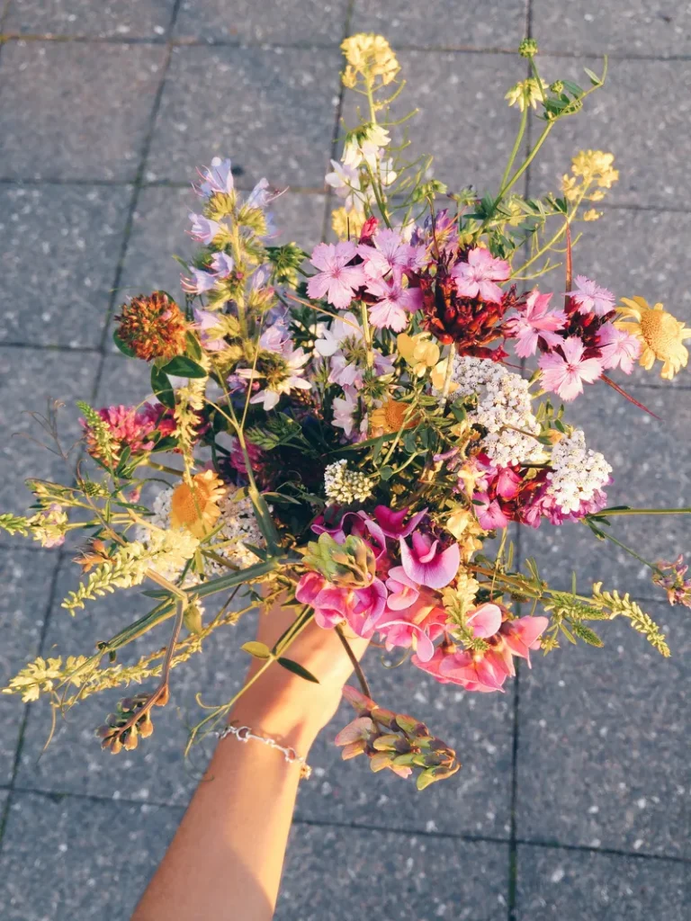 A wildflower bouquet filled with an assortment of different blooms.