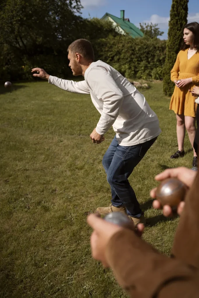 A group of guests playing a lawn game.