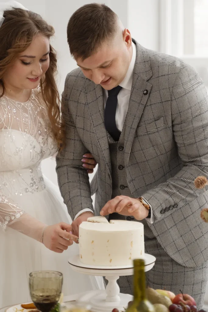 A simple rustic wedding cake, it's a single layer focusing on the frosting with simple gold leaf.