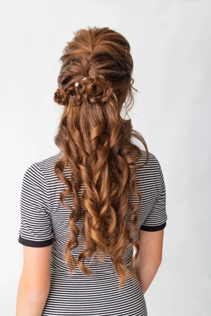 A Boho Half Up Half Down Hairstyles to use for your wedding, its intricate but still breezy.