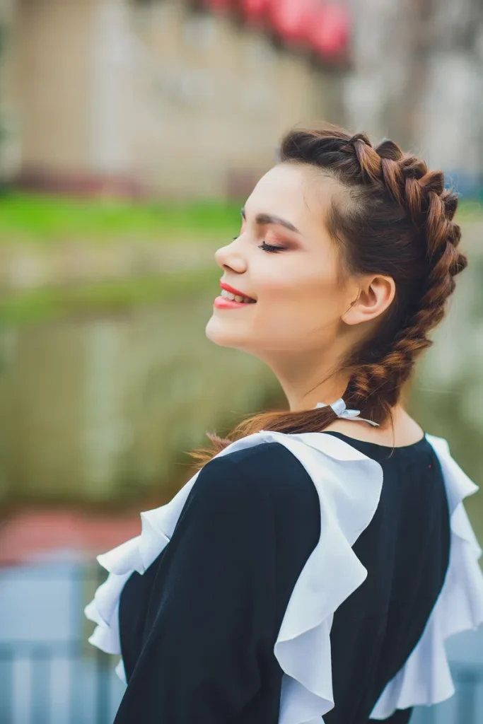 A loose boho bridesmaid side fishtail braid.
