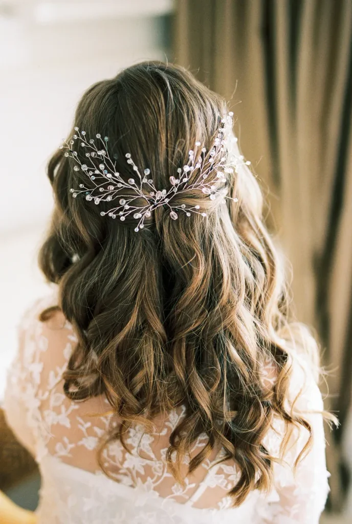 A boho wedding hair half up with a hair vine.