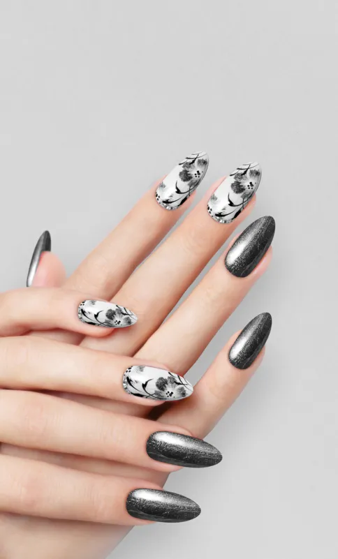 A grey chrome nail look with some beautiful flower accent nails.