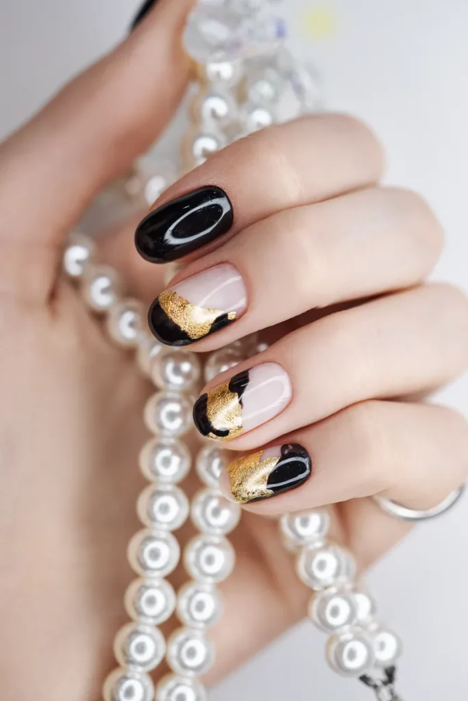 A beautiful nail set with gold accents.