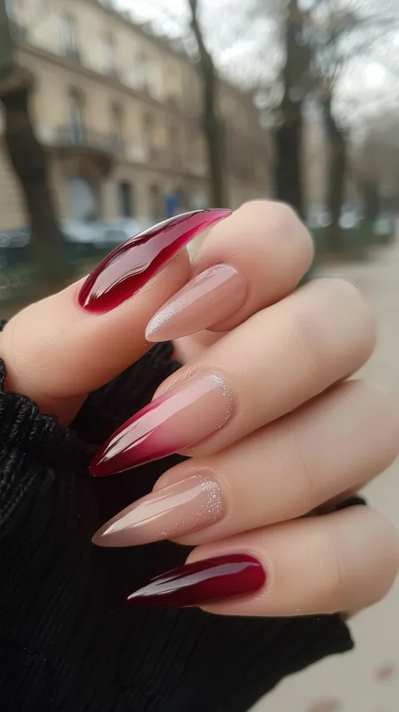 A look at what an ombre nail in a darker red to nude can look like.