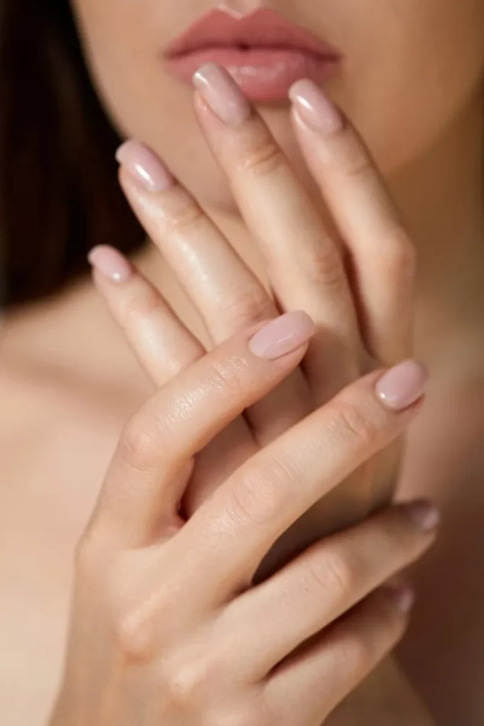 Sheer pink bridal nails make for the perfect soft look.