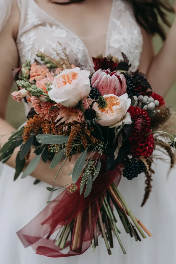 A rustic wedding bouquet that shows off the kinds of colors and textures you can use in fall wedding bouquets.