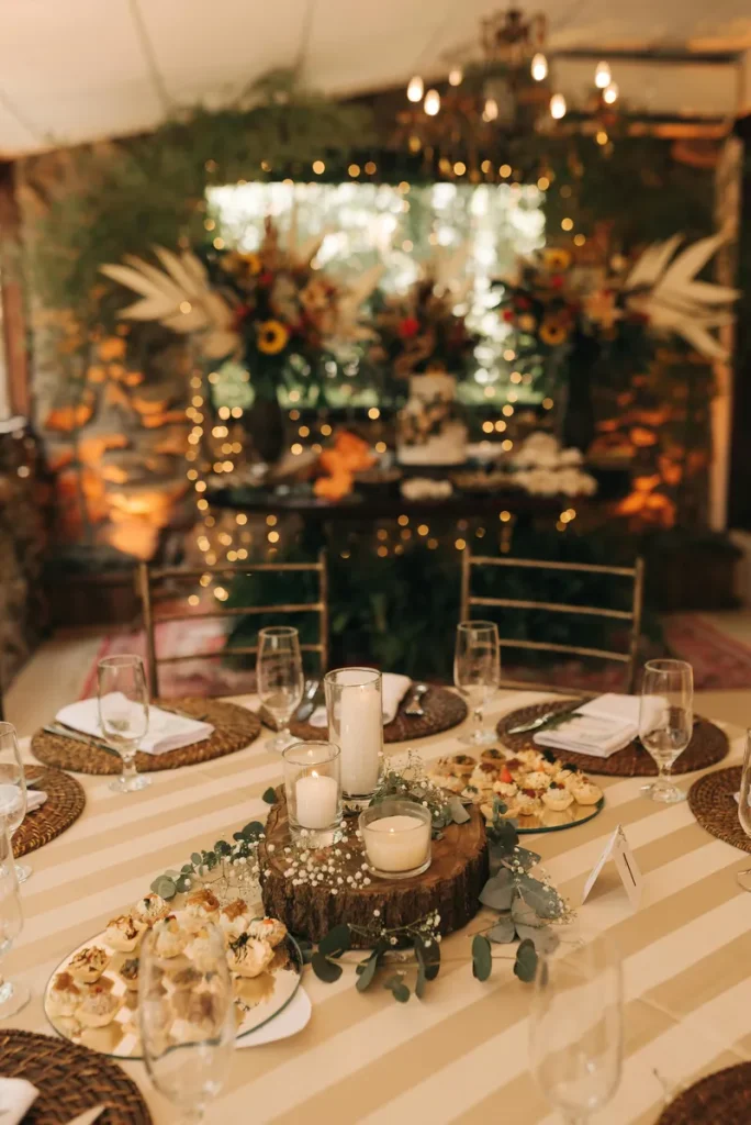 Rustic fall wedding centerpieces with fun vibes and wood slices, candles and surrounded by snacks.