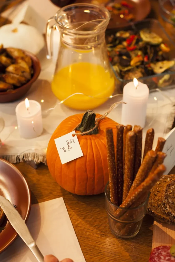 Simple rustic fall wedding centerpieces with some pumpkins and snacks around