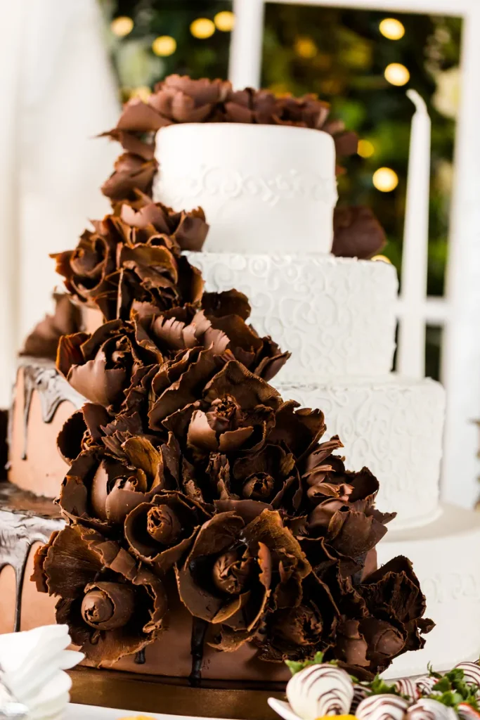 A chocolate fall wedding cake with cascading chocolate roses.
