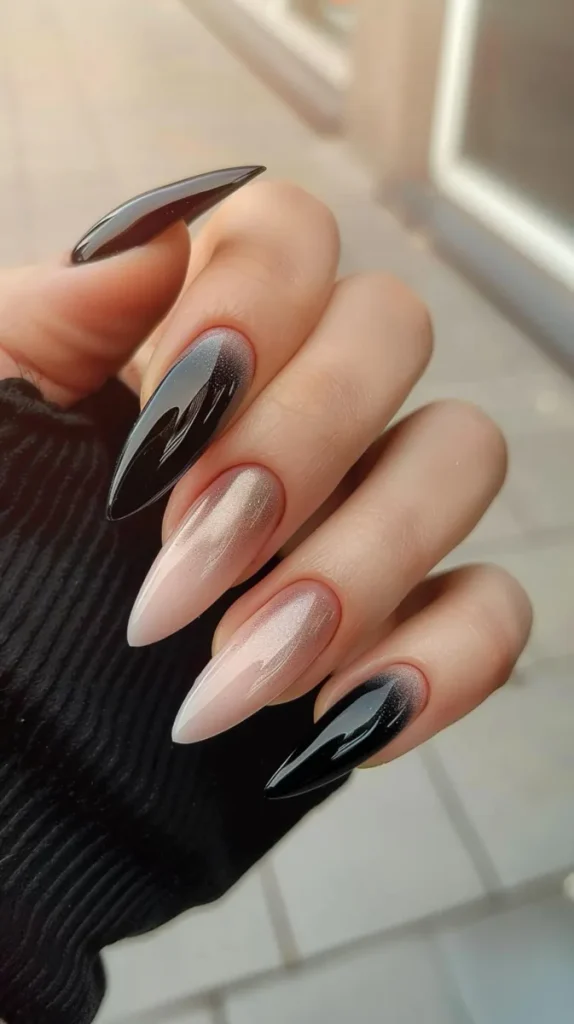 A delicate soft black ombre with two feature nails that have a rose gold sparkle into a nude blush that you could wear for your fall wedding nails.