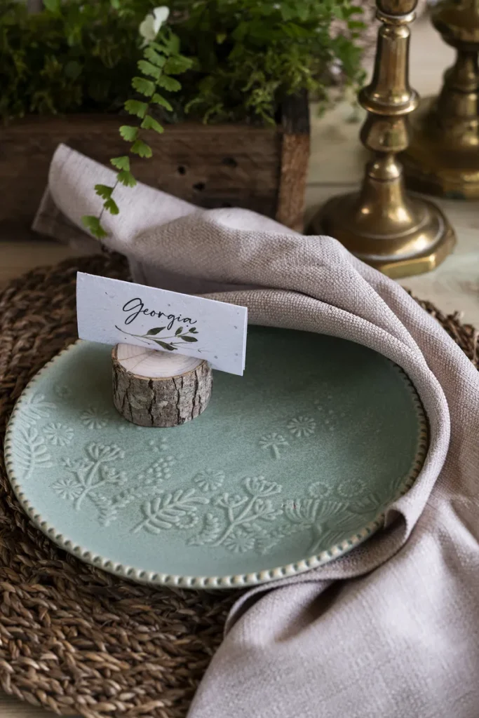 A look at what a botanical place card can look like in your forest wedding table decor.