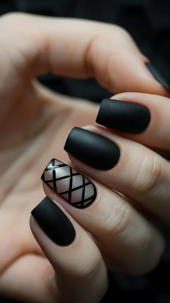 A matte black nail look with a feature nail with a criss cross pattern that you can use for your fall wedding nails if you like.