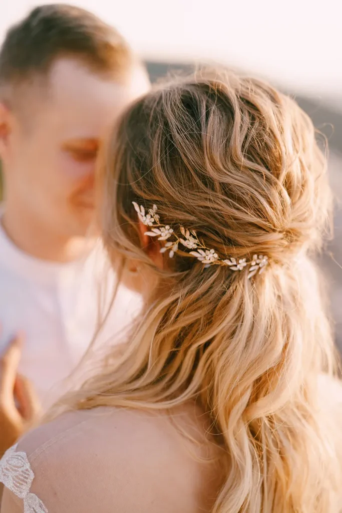 A twisted half updo for a bohemian wedding hair look.