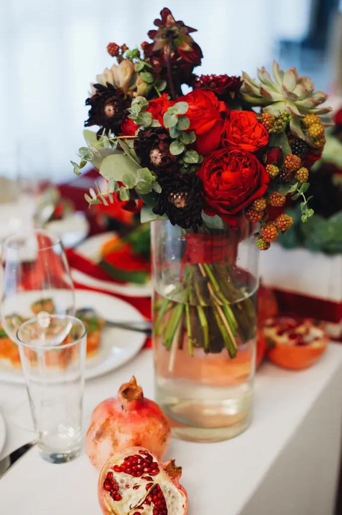 A beautiful fall wedding centerpiece featuring jewel-tones.