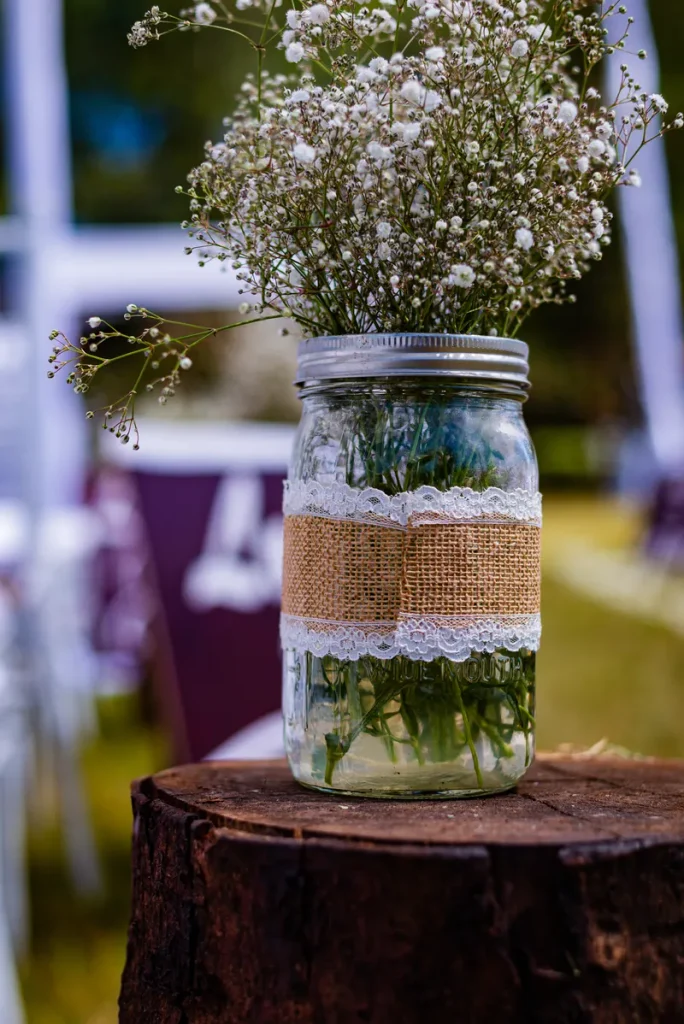 A beautiful fall wedding centerpiece in a mason jar.