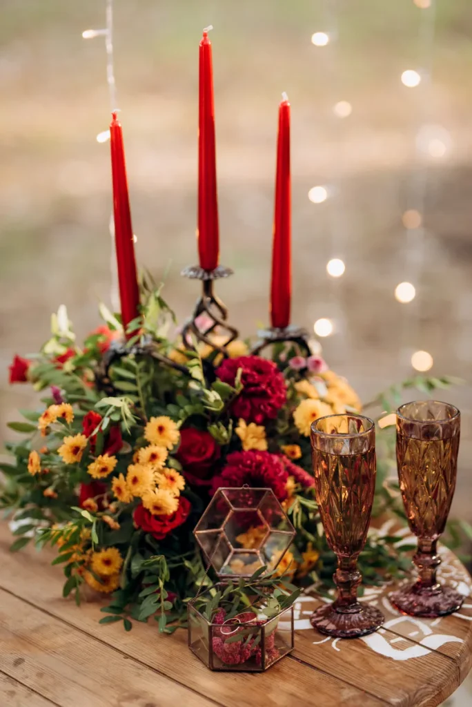A simple fall wedding centerpiece featuring some lovely candles.