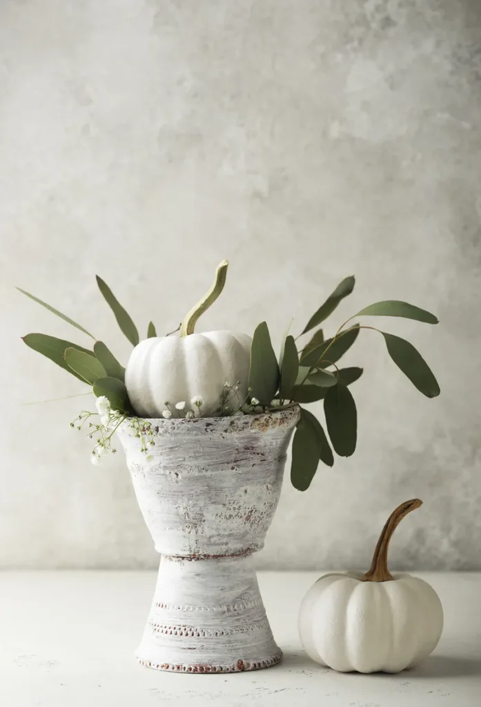 A white pumpkin fall wedding centerpiece.